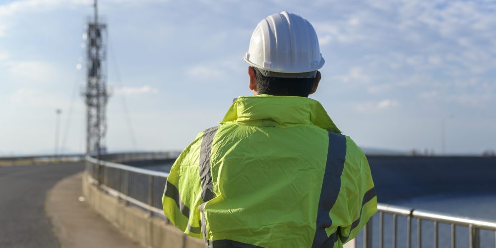 Engineer is using tablet Analytics engineering data.